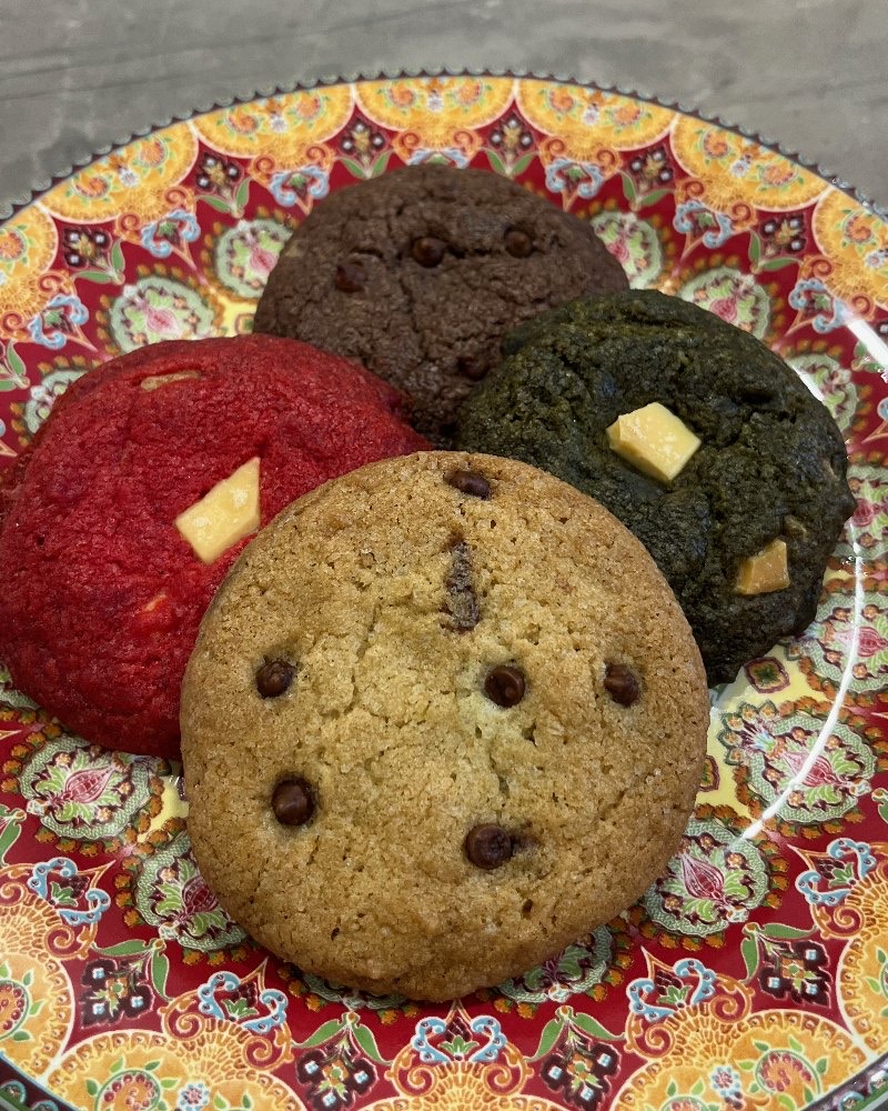 An assortment of cookies on a patterned plate