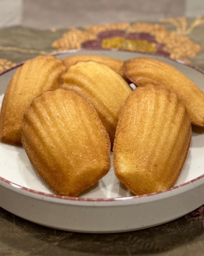 Madeleines on a plate, shell side up